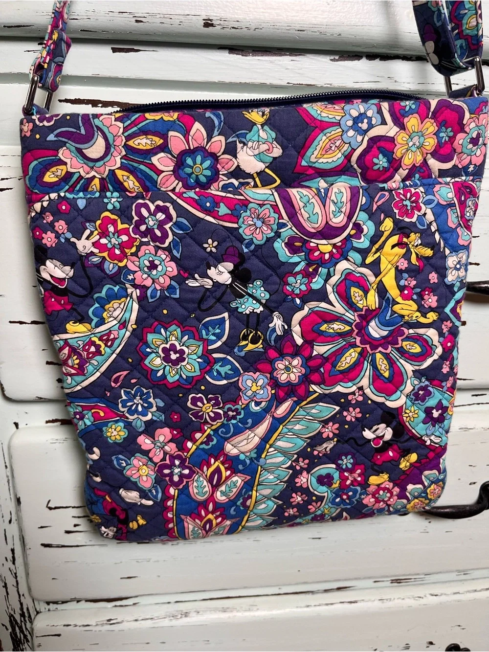 Vera Bradley Disney Collab Triple Zip Hipster in sensational six pattern.